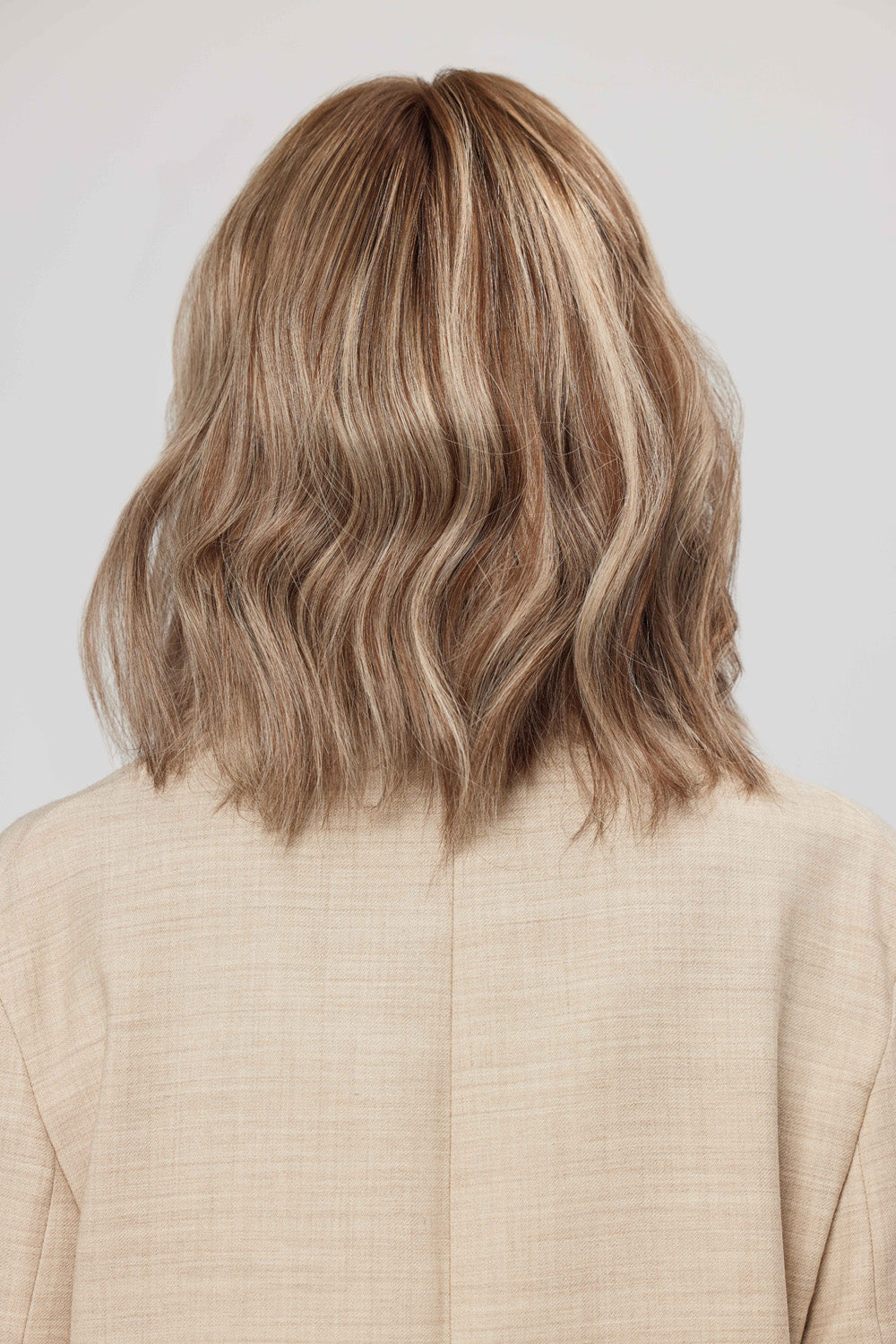 Woman wearing a BHBD Celeste Full lace wig with cool-toned highlights.