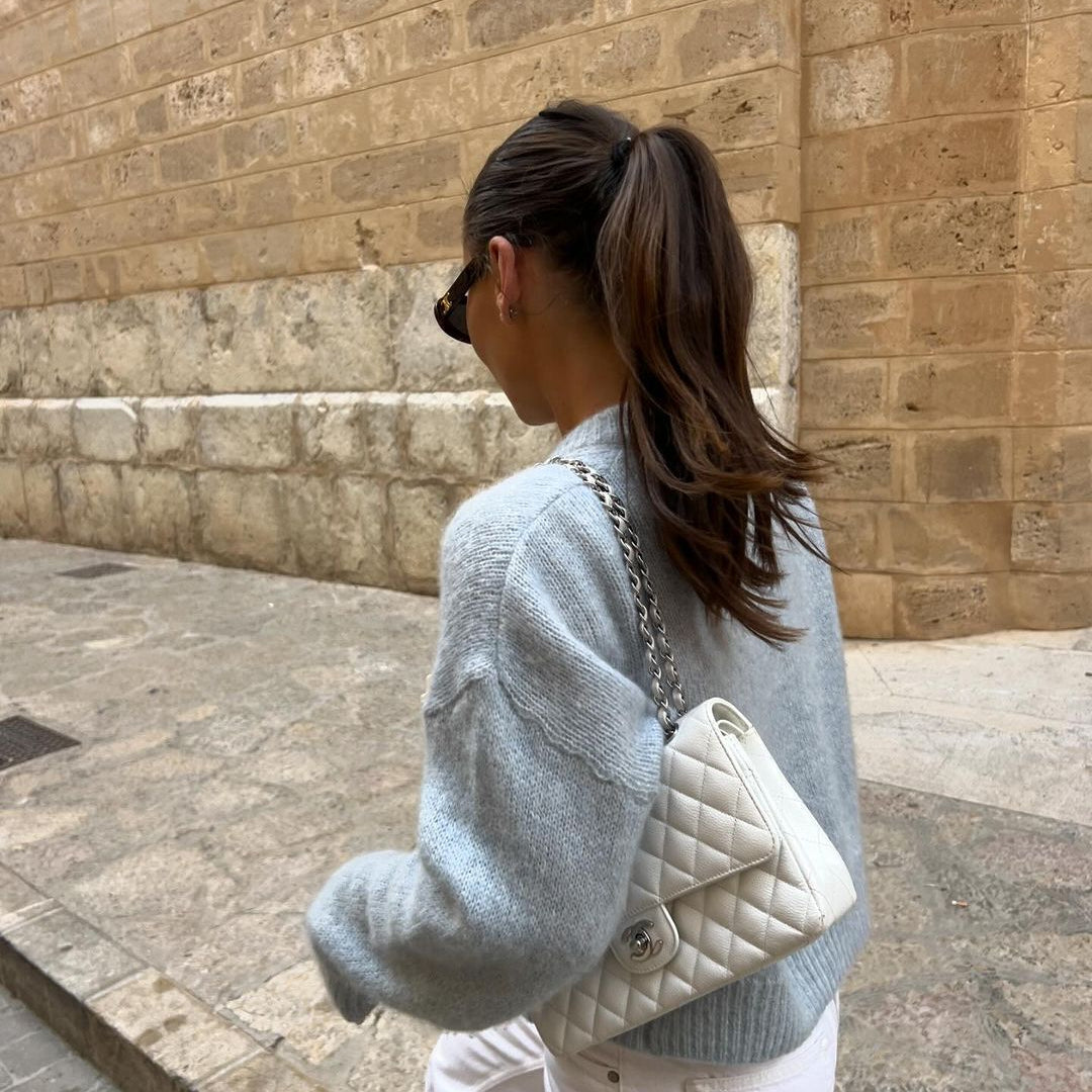 Woman with long dark brown ponytail created with BHBD hair extensions.