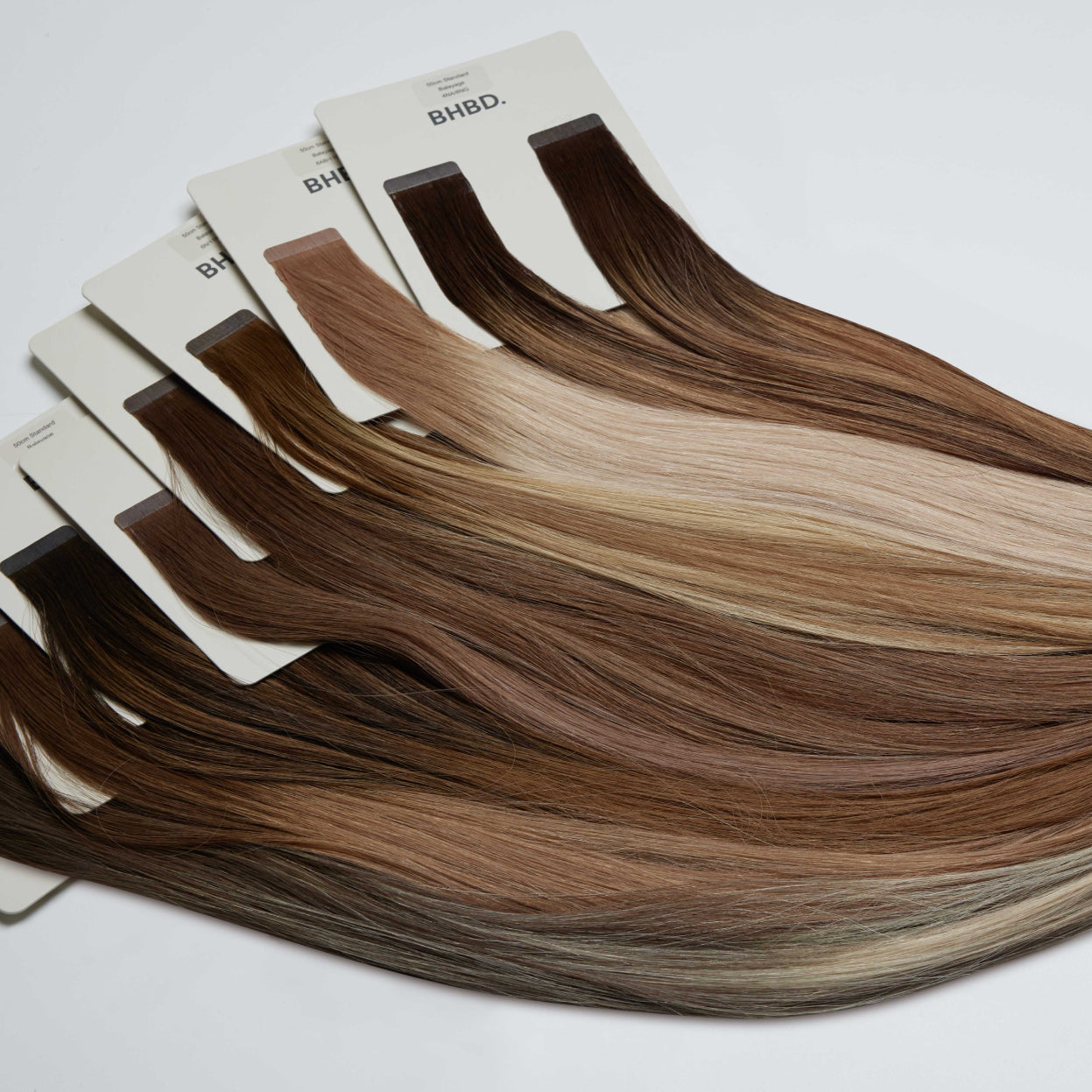 BHBD tape extensions in various shades of brown.